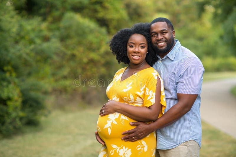 Loving African American couple expecting a child. Loving African American couple expecting a child.