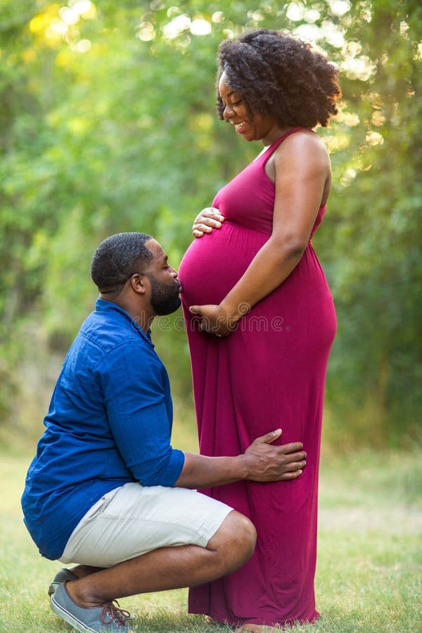 Loving African American couple expecting a child. Loving African American couple expecting a child.