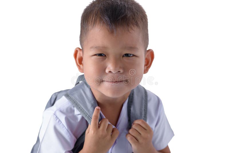 Portret van de Aziatische jongen van het Land in eenvormige school geïsoleerd op witte achtergrond stock afbeelding Portret van de Aziatische jongen van het Land in eenvormige school geïsoleerd op witte achtergrond stock afbeelding
