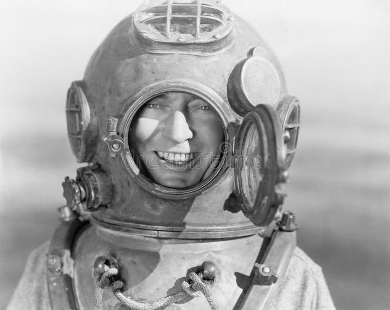 Portrait of man in diving helmet (All persons depicted are no longer living and no estate exists. Supplier grants that there will be no model release issues.). Portrait of man in diving helmet (All persons depicted are no longer living and no estate exists. Supplier grants that there will be no model release issues.)