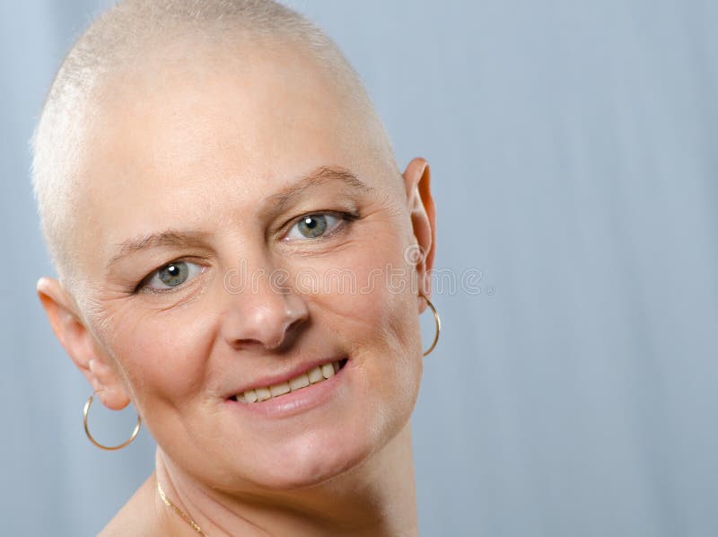 Portrait of happy cancer survivor in studio after successful chemotherapy. Portrait of happy cancer survivor in studio after successful chemotherapy.