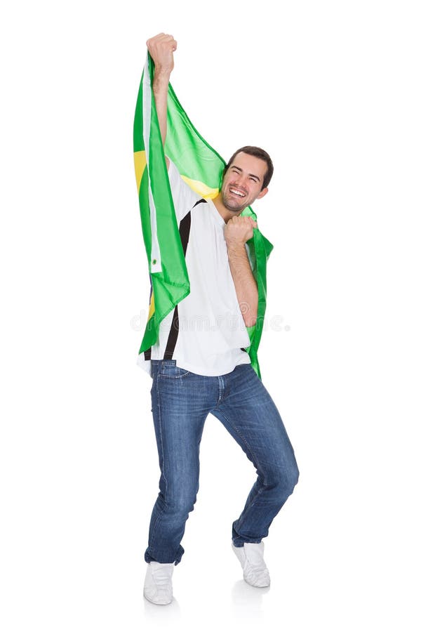 Portretul unui om fericit care deține un steag brazilian royalty free stock photos