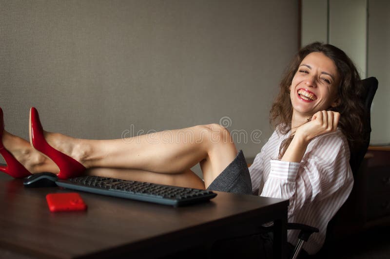 Portriat of Brunette with Legs on Office Table with Laptop, Hot Woman in  Red Shoes on High Heels Sitting at the Desk Stock Image - Image of desire,  desk: 238969175