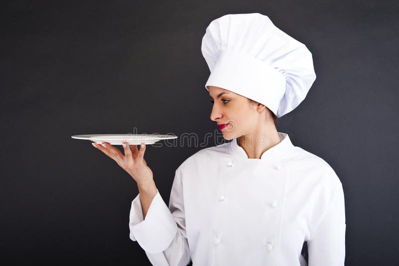 Porträt des Chefs der jungen Frau mit Platte lizenzfreies stockfoto Porträt des Chefs der jungen Frau mit Platte lizenzfreies stockfoto