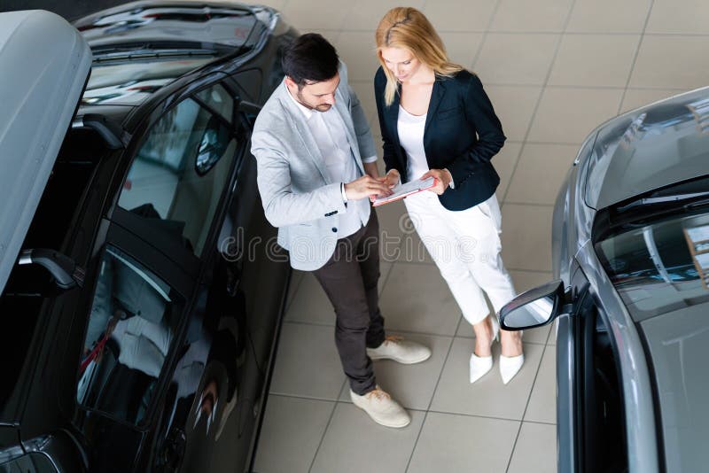 Portrait of happy customer buying new car in salon. Portrait of happy customer buying new car in salon