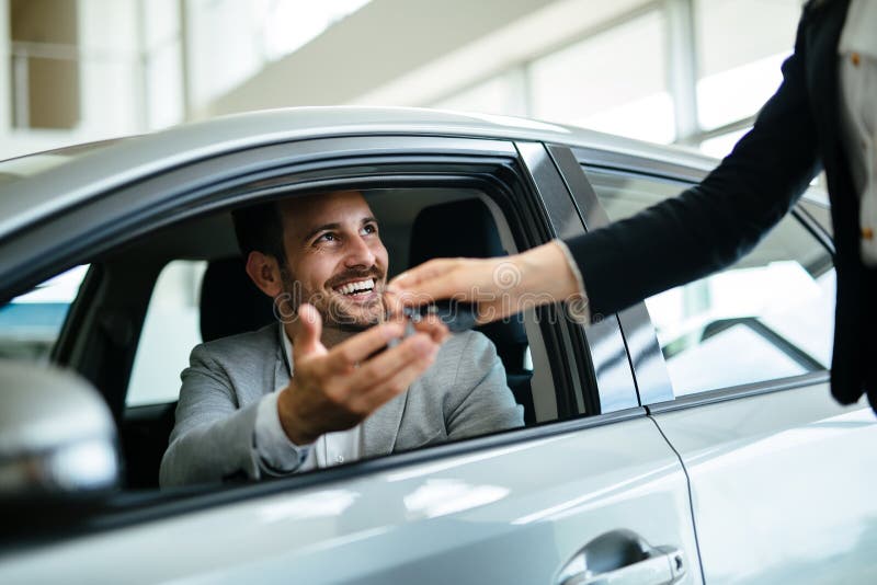 Portrait of happy young customer buying new car. Portrait of happy young customer buying new car