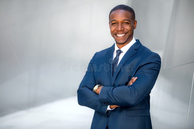 Portrait of male african american professional, possibly business executive corporate CEO, finance, attorney, lawyer, sales, stylish modern black american businessman, handsome smiling portrait next to financial building. Portrait of male african american professional, possibly business executive corporate CEO, finance, attorney, lawyer, sales, stylish modern black american businessman, handsome smiling portrait next to financial building