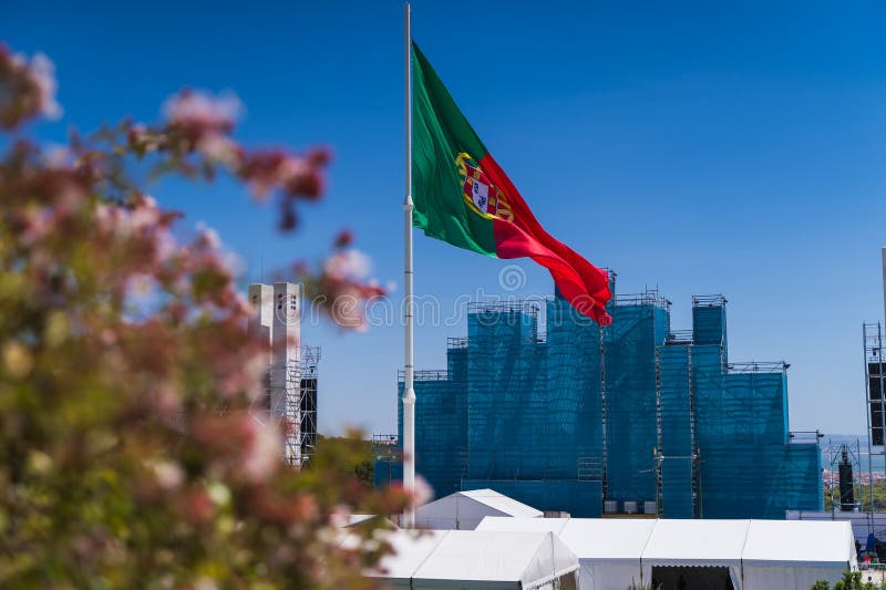 Portuguese flag and papal altar in Lisbon during the opening Mass of World Youth Day 2023 in Edward VII Park. 11th anniversary of the election of Pope Francis to the Saint Peter. Portuguese flag and papal altar in Lisbon during the opening Mass of World Youth Day 2023 in Edward VII Park. 11th anniversary of the election of Pope Francis to the Saint Peter.