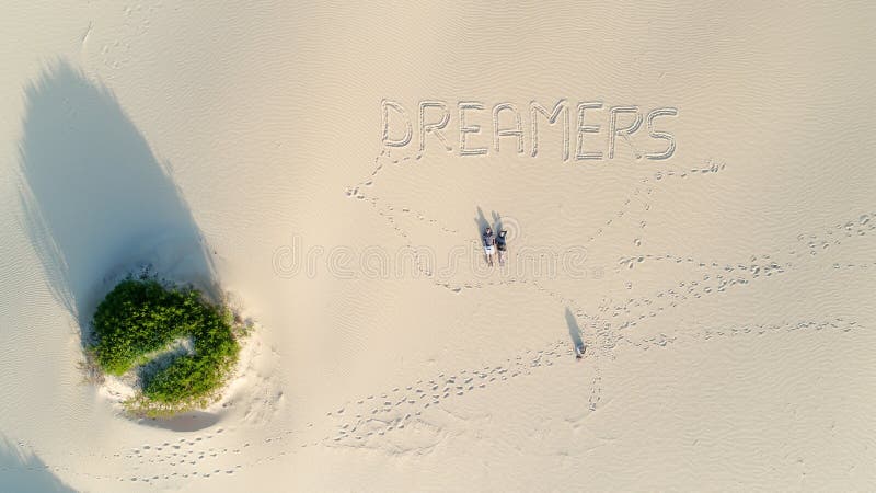 Couple at the beach drone view