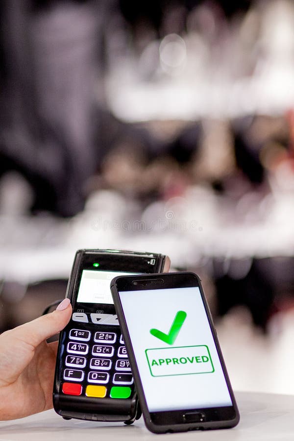 POS Terminal, Payment Machine with Mobile Phone on Store Background.  Contactless Payment with NFC Technology Stock Photo - Image of paying,  consumerism: 147547676
