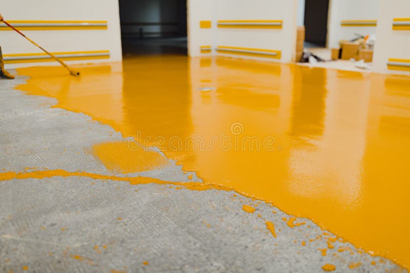 New polished concrete floor covered with a layer of yellow epoxy resin. New polished concrete floor covered with a layer of yellow epoxy resin