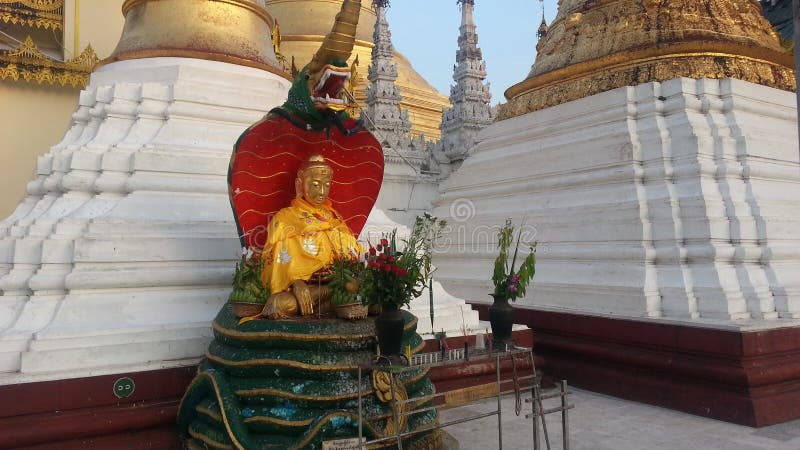 Seated Buddha image at The Shwedagon Pagoda is Buddha Nacprk The Buddha`s birthday on Saturday. People born thisday Worship to pray. Seated Buddha image at The Shwedagon Pagoda is Buddha Nacprk The Buddha`s birthday on Saturday. People born thisday Worship to pray.