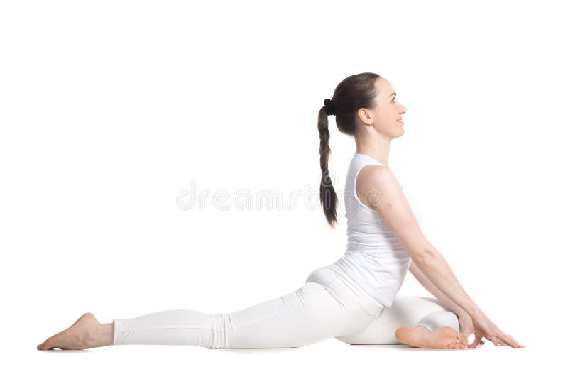 Sporty beautiful young woman in white sportswear sitting in easy variation of One Legged King Pigeon Pose - Eka Pada Rajakapotasana 1 (Swan - yin posture), studio full length, isolated. Sporty beautiful young woman in white sportswear sitting in easy variation of One Legged King Pigeon Pose - Eka Pada Rajakapotasana 1 (Swan - yin posture), studio full length, isolated