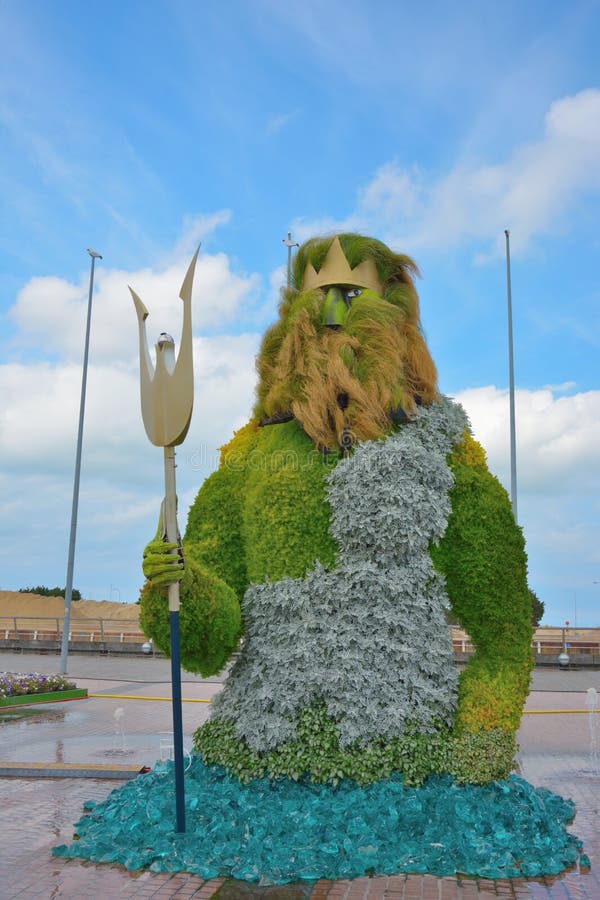 Poseidon sculpture made from flowers is in Greek mythology the god who rules over the sea