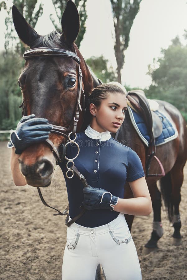 Posing for the Camera. Happy Latin Woman with Her Horse on the Ranch at ...