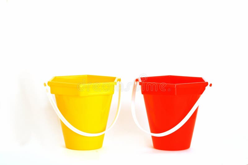 Red and yellow beach toy buckets. Red and yellow beach toy buckets