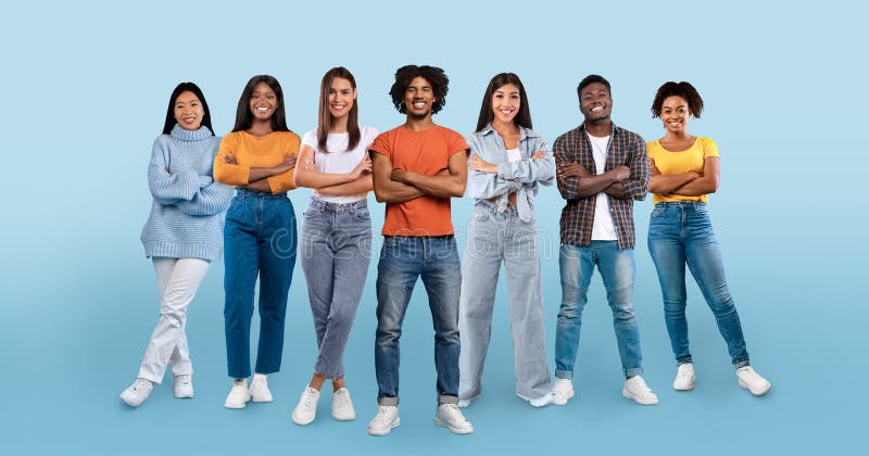 Positive confident young diverse people in casual with crossed arms on chest, enjoy teamwork royalty free stock photos