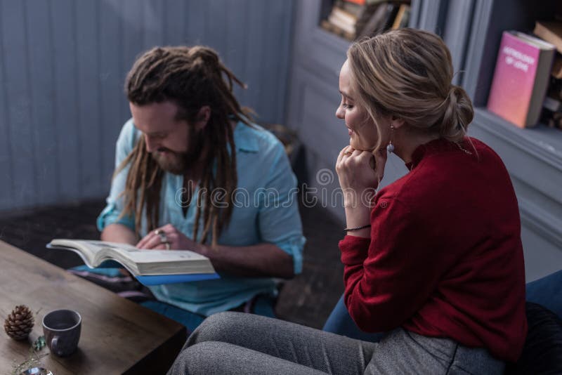 Positive delighted blonde woman touching her chin royalty free stock images Positive delighted blonde woman touching her chin royalty free stock images