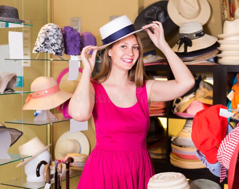 Positive Girl Try on Floppy Hat in Store Stock Photo - Image of happy ...