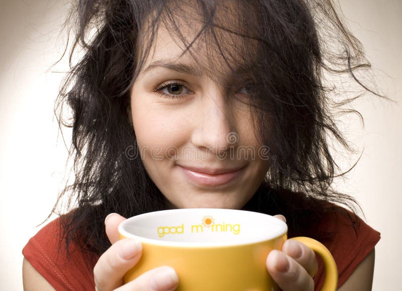 Positive girl with yellow cup titled Good morning