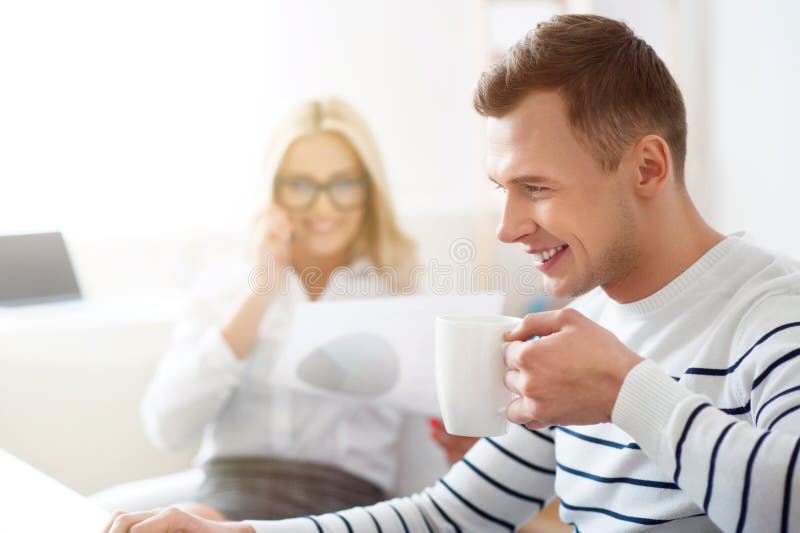 Positive Guy Drinking Coffee at Work Stock Photo Image of office