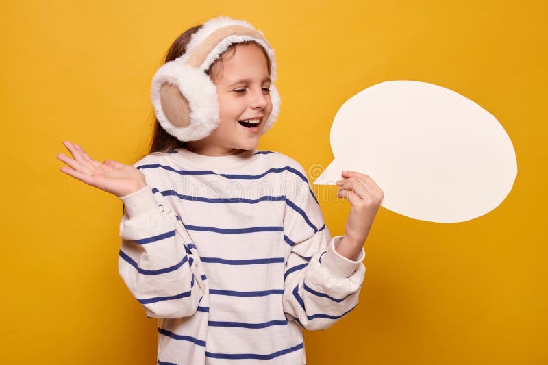 Positive happy overjoyed child with thought bubble presenting empty space for text showing free space for idea in mockup stock photography