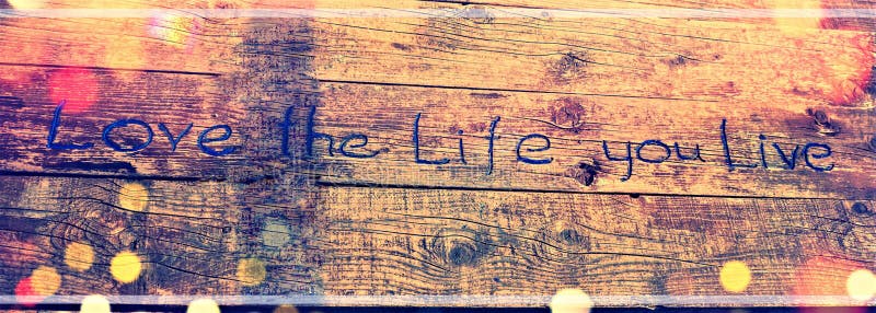Positive inspiring quote written carved in wood Love the life you live. Best motivational quotes, inspirational quotes and sayings stock images Positive inspiring quote written carved in wood Love the life you live. Best motivational quotes, inspirational quotes and sayings stock images