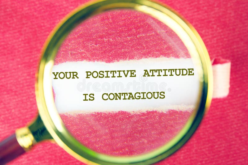Positive Message Promoting an Uplifting Mindset is Highlighted Through a Magnifying Glass on a Vibrant Pink Background stock image