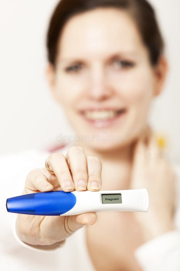 Black Woman Hand Holding a Positive Pregnancy Test African People