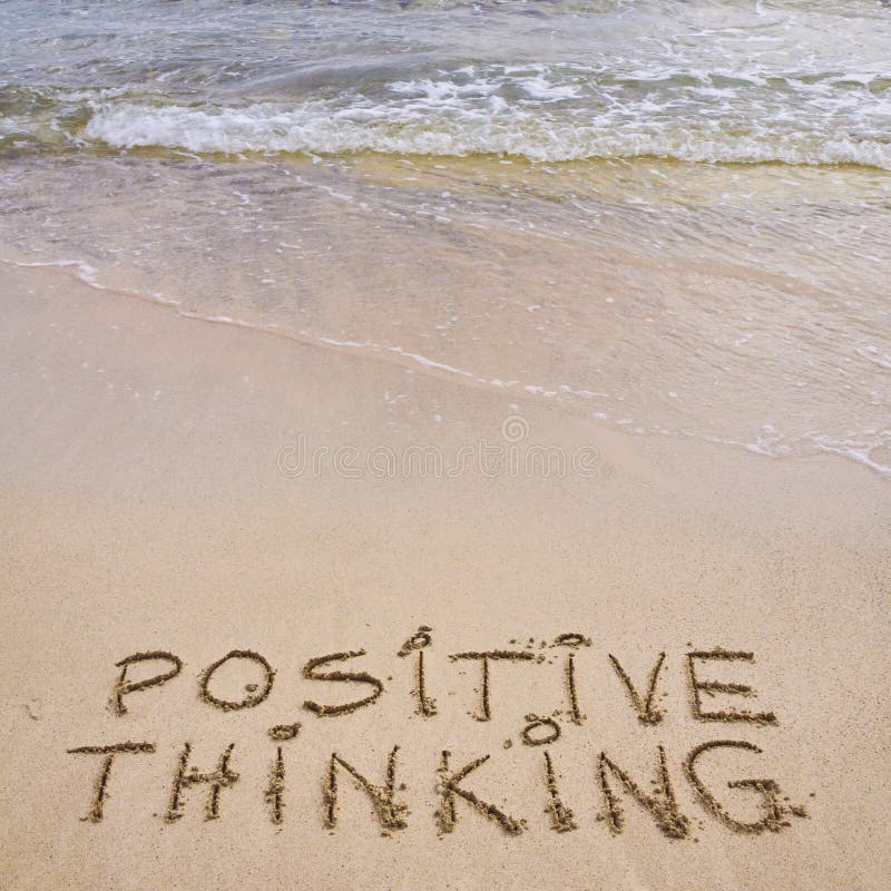 Positive Thinking message written on sand, with waves in background. Stress free concept royalty free stock photos