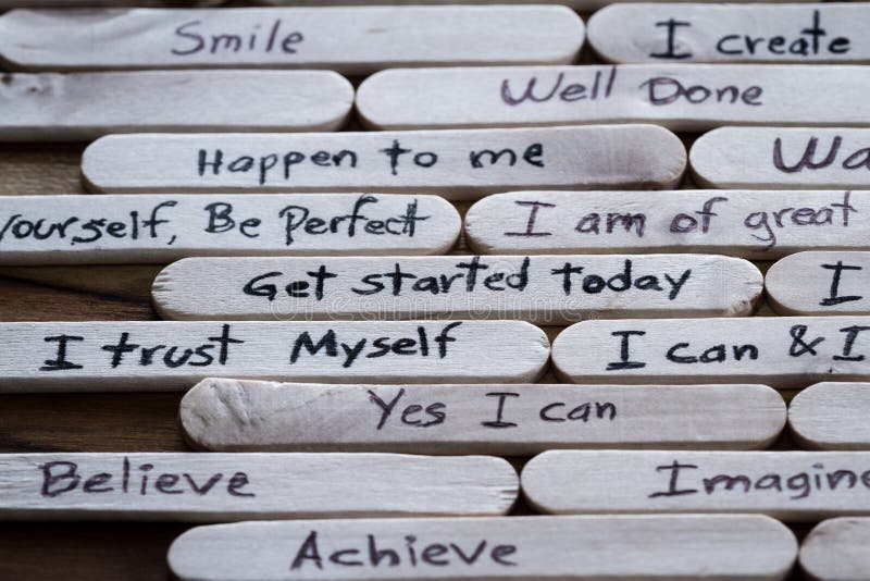 Positive thoughts for self esteem building. Close up of a hand written message on a popsicle stick as a self esteem building concept royalty free stock photos Positive thoughts for self esteem building. Close up of a hand written message on a popsicle stick as a self esteem building concept royalty free stock photos