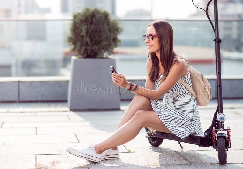 Positive woman using cell phone stock photos Positive woman using cell phone stock photos