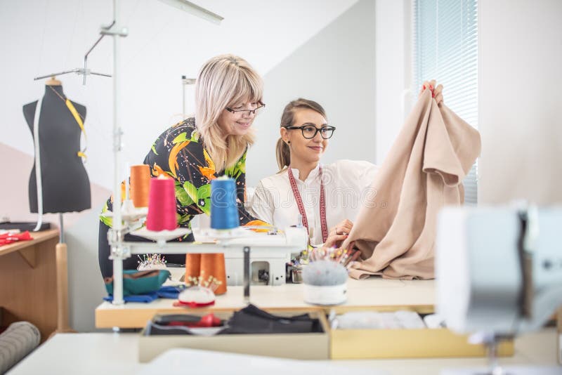 Positive Working Environment As Two Female Tailors Check the Quality of ...