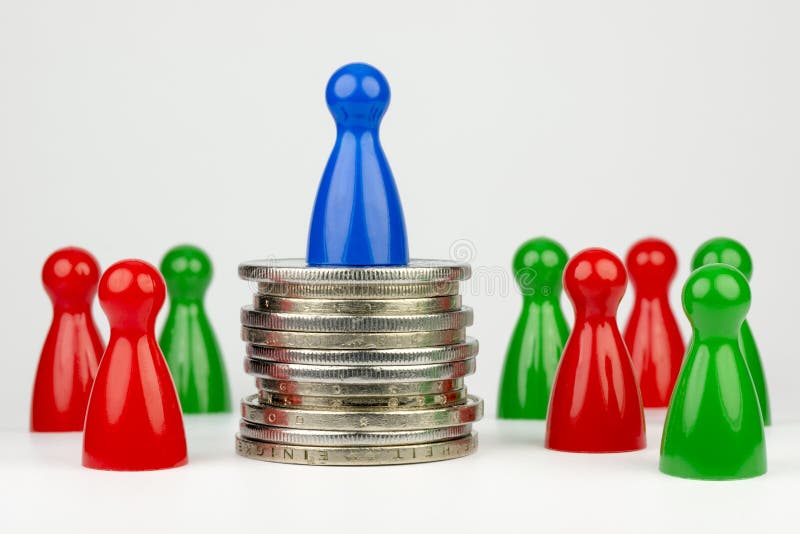 Conceptual financial position represented with colored play pieces and coins. Conceptual financial position represented with colored play pieces and coins