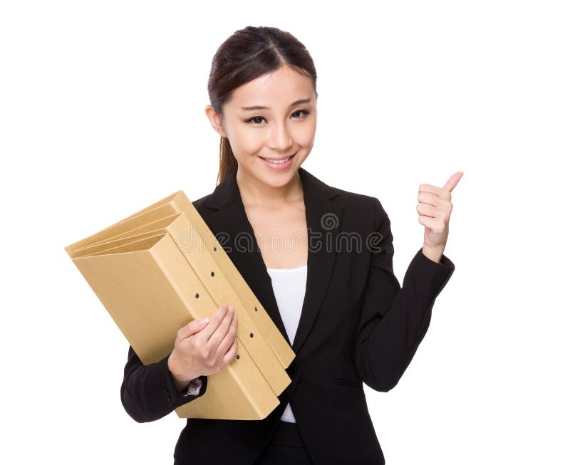 Posse da mulher de negócios com dobrador e polegar acima imagem de stock royalty free Posse da mulher de negócios com dobrador e polegar acima imagem de stock royalty free