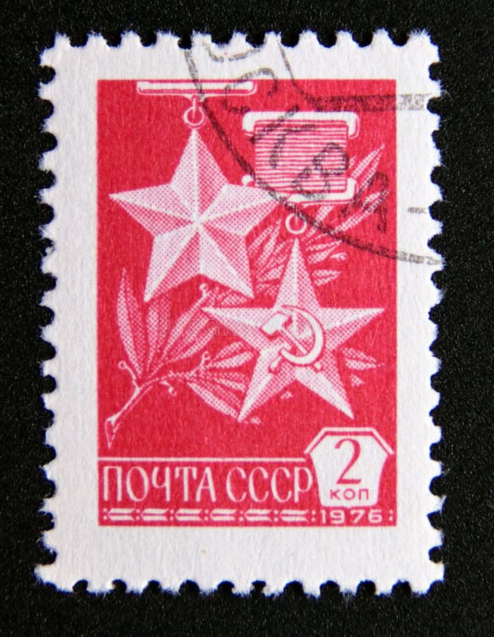 Post stamp printed in soviet union, cccp, 1976. Gold star and hammer and sickle medals. Value 2 russian kopek. From the series definitive issue. Post stamp printed in soviet union, cccp, 1976. Gold star and hammer and sickle medals. Value 2 russian kopek. From the series definitive issue.