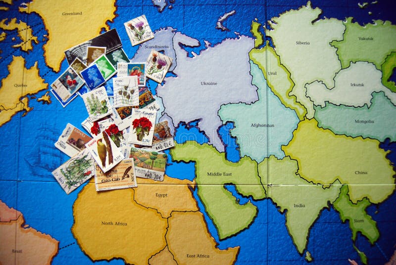 Some postage stamps on a world map. Some postage stamps on a world map