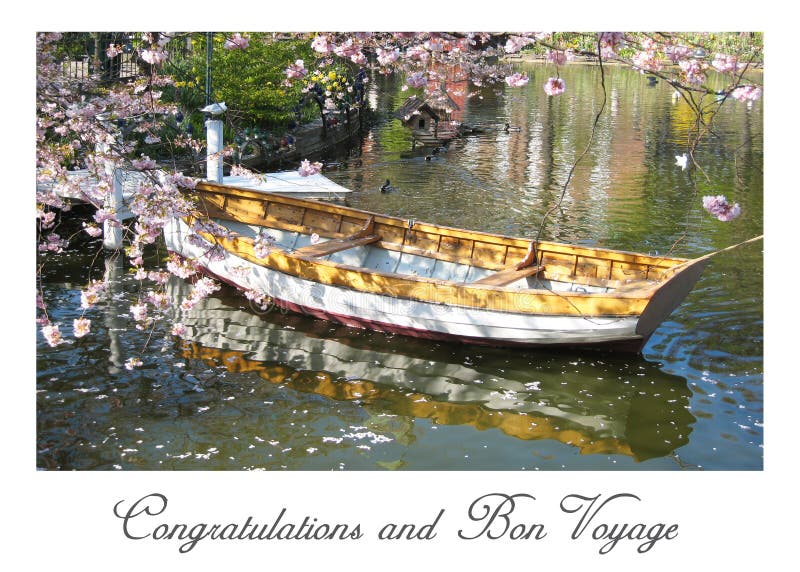 Postcard with a beautiful view of a wooden boat surrounded by a romantic sea of ​​flowers in a small lake - in Tivoli in Copenhagen in Denmark - postcard size format with a romantic script Text: Congratulations and Bon Voyage. Postcard with a beautiful view of a wooden boat surrounded by a romantic sea of ​​flowers in a small lake - in Tivoli in Copenhagen in Denmark - postcard size format with a romantic script Text: Congratulations and Bon Voyage