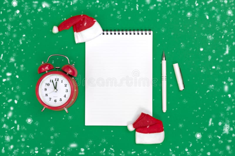 Postcard Happy New Year Flat lay composition with scroll and Christmas decor on green color background.