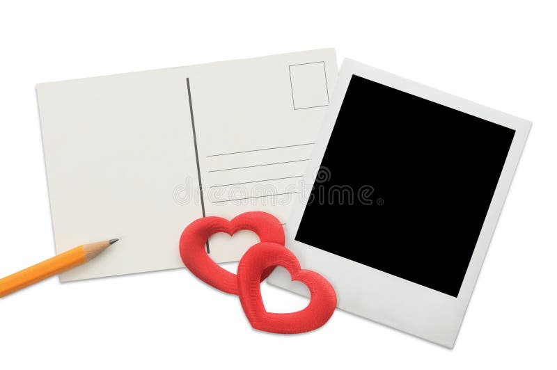 Postcard, instant photo frame and red hearts