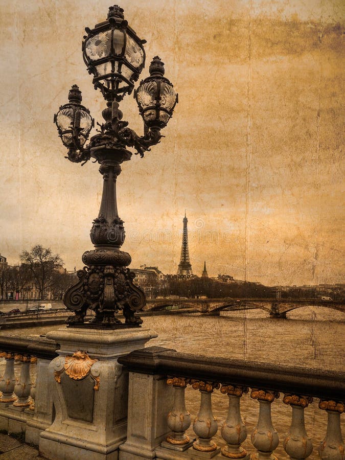 Postcard of Paris in retro style: View from bridge Alexandre III with candelabra in the foreground and Eiffel tower in the background; copy space. Postcard of Paris in retro style: View from bridge Alexandre III with candelabra in the foreground and Eiffel tower in the background; copy space