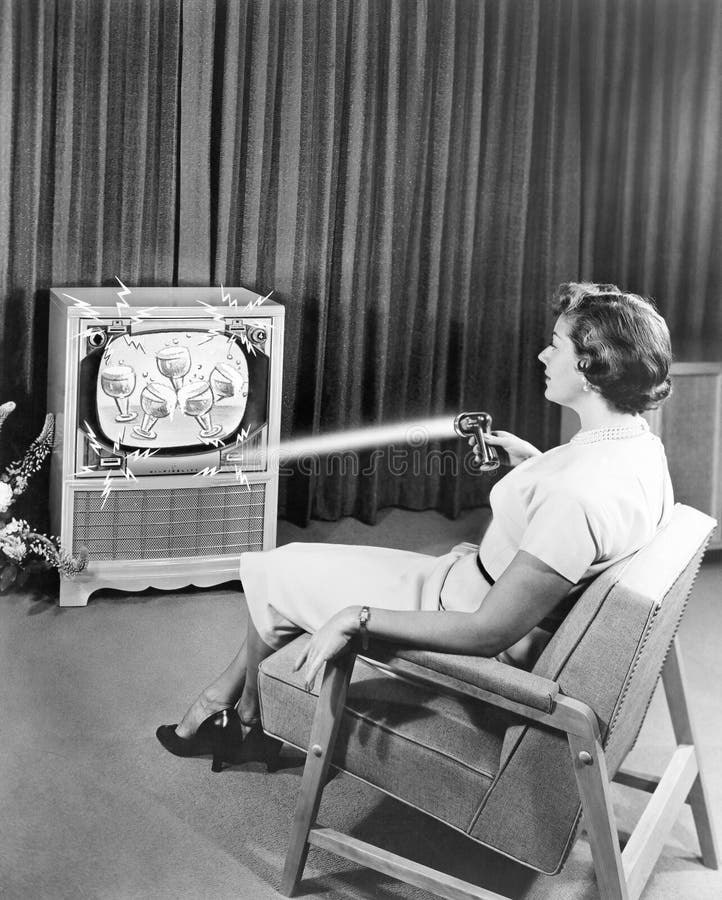 Early Zenith remote control TV set, June 1955 (All persons depicted are no longer living and no estate exists. Supplier grants that there will be no model release issues.). Early Zenith remote control TV set, June 1955 (All persons depicted are no longer living and no estate exists. Supplier grants that there will be no model release issues.)