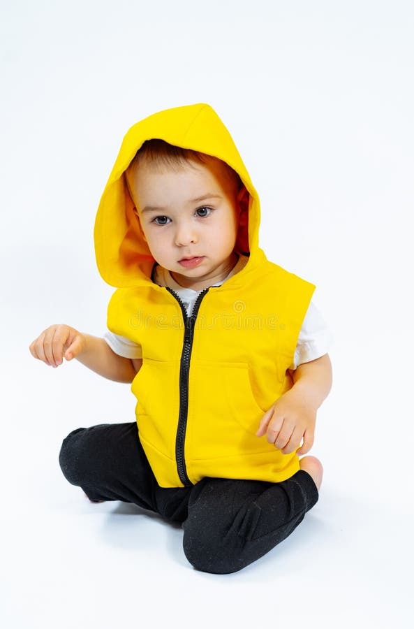 Cute little child posing in studio. Adorable cheerful kid on white background. Cute little child posing in studio. Adorable cheerful kid on white background..