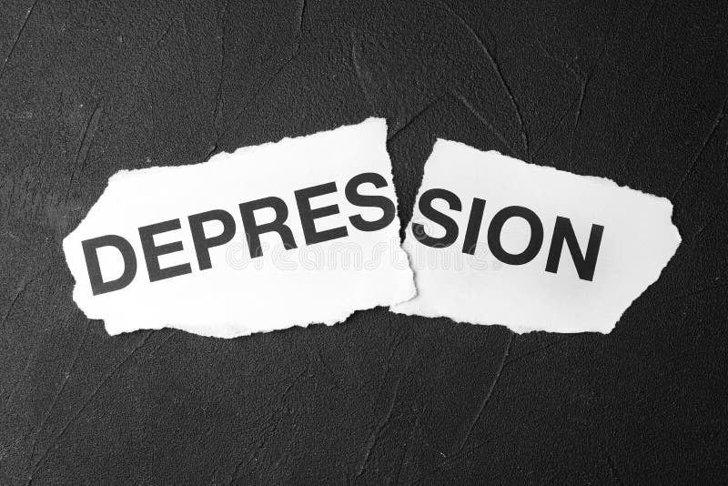 Poszarpany papier z słowo depresją na czarnym, odgórnym widoku