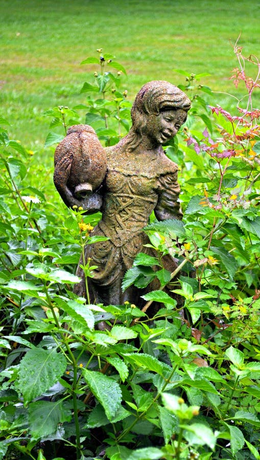 Girl statue in a garden. Girl statue in a garden