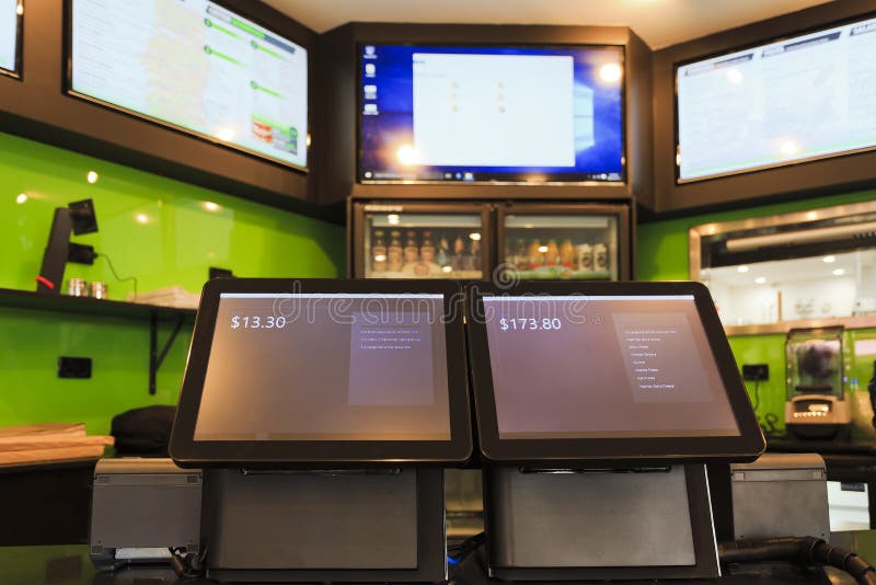 2 touchscreen customer facing tablets in a cafe taking orders and serving as smart POS terminals with printers for receipts. 2 touchscreen customer facing tablets in a cafe taking orders and serving as smart POS terminals with printers for receipts