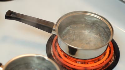 Boiling Pot Of Water On Hot Electric Burner Stock Photo, Picture and  Royalty Free Image. Image 34317573.