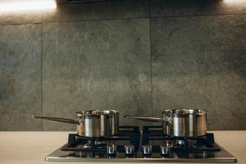 Pot on the Gas Stove and Cooking in Kitchen. Stock Photo Image of