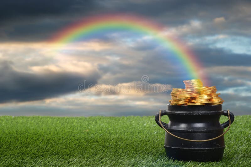 Closeup of pot of gold with rainbow
