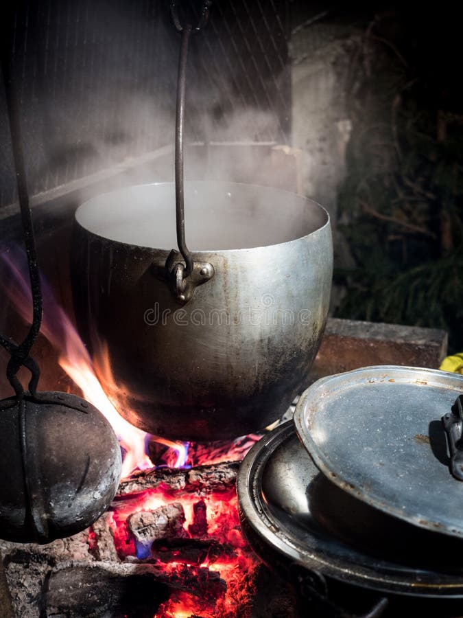 Pot Hanging from the Fireplace Above the Wood Fire Stock Photo Image